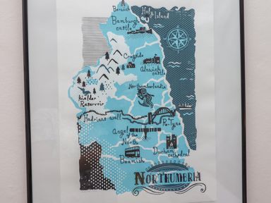 A framed illustrated map of Northumbria with landmarks and places labeled on a wall