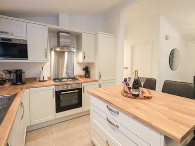 A kitchen with modern appliances at Unique Luxury Lodge, 1 Langdale, White Cross Bay near Windermere