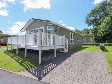 A house with decking and garden area at Serenity in Kilgetty