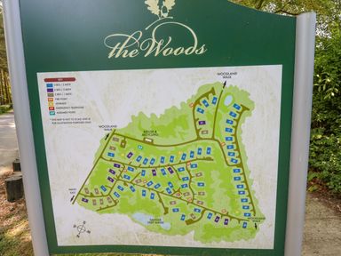 A map of The Woods showing house numbers and key locations including woodland walk refuse and recycling and danger deep water at 64 Acorn Lodge Kenwick Park in Louth