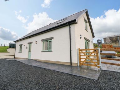 A house with a pathway and gate at Y Beudy near Llanilar