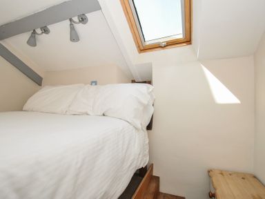 A bedroom with a bed and skylight at Little Coombe Trehunist near Liskeard