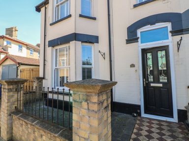 A front entrance with a door and window at Sunrise House in Pakefield near Lowestoft