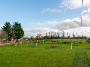 A playground with swings and equipment at Dove in Shobdon