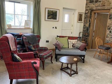 A living room with armchairs and a sofa at The Croft near Newtown-Crommelin