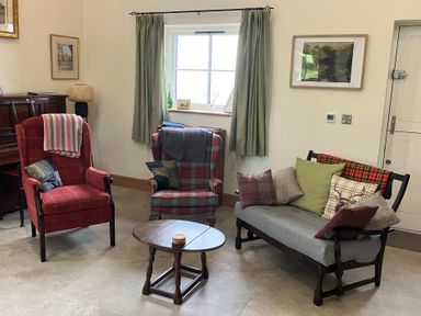 A living room with two armchairs and a sofa at The Croft in Newtown-Crommelin near Cloughmills