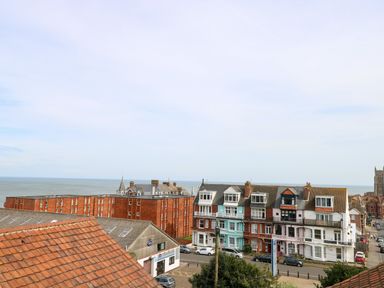 A coastal town view with residential buildings near the ocean at Flat 3 in Cromer