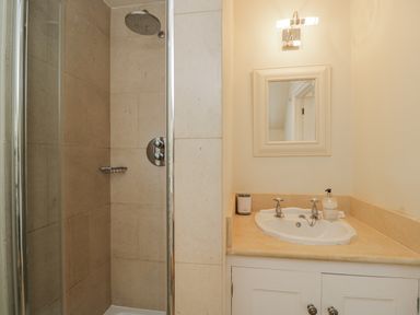 A bathroom featuring a shower and a sink at The Old Hall in Tetbury