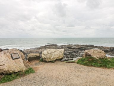 A rocky coastline with large stones and a plaque overlooking the sea at Old Field House Slade near Fethard-On-Sea County Wexford