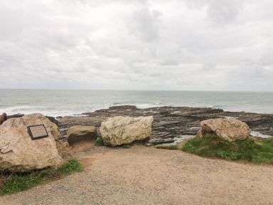A rocky coastline with large boulders and the ocean in the background at Old Field Hideaway Slade near Fethard On Sea County Wexford