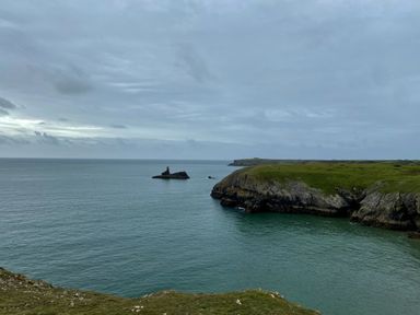 A coastal view with cliffs and rock formations at Tower Cottage Near Pembroke