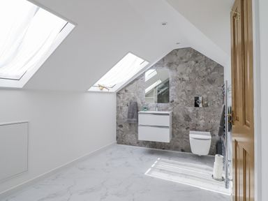 A bathroom with skylights and a vanity at Neptune Cottage in Conwy