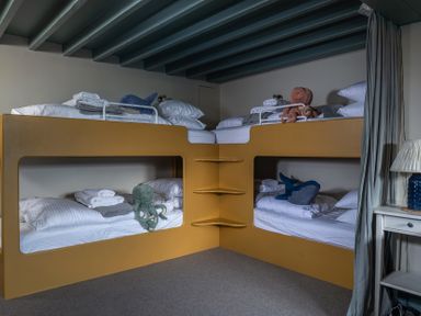 A bedroom with bunk beds and toys at Astondene, East Cliff Southwold