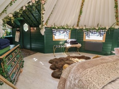 A bedroom with a bed and decorative features at Applejacks Orchard in Holywell