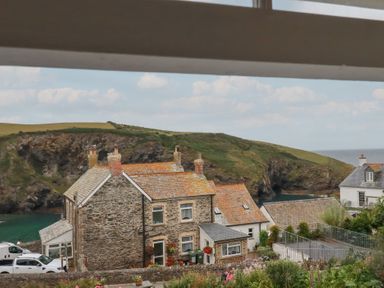A view of houses and the coastline at 84 Fore Street