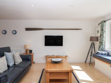 A living room with a sofa and coffee table at 4 Burgh Island Causeway in Bigbury