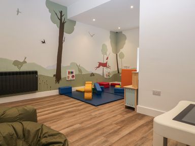 A playroom with colorful blocks and a child's table at Apartment 2 in Keswick