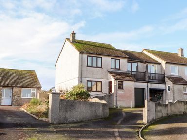 A semi detached house with a garage and driveway at Chi an Vre in Newlyn