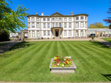 A building with a lawn and flower bed at Apt 6 @ Hunter's Quay Bridlington