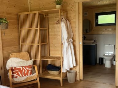 A bathroom with a toilet and wash basin at Primrose in Higher Wambrook near Chard
