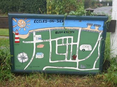An illustrated map of Bush Estate showing roads landmarks and a coastline at White Rabbit Cross Lane in Eccles-On-Sea