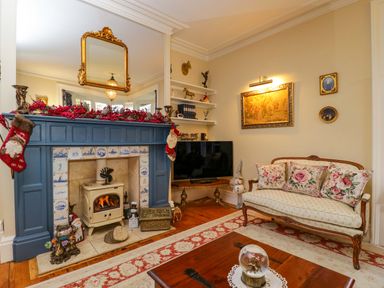 A living room with a fireplace and sofa at White House