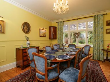 A dining room with a table set for meals at White House
