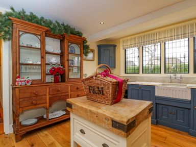 A kitchen with a wooden cupboard and sink at the White House