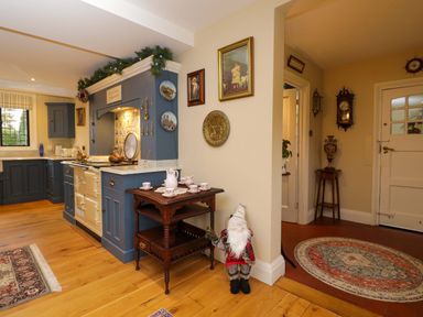 A kitchen with a stove and cabinets at White House