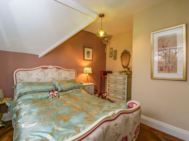 A bedroom with a bed and nightstand at White House