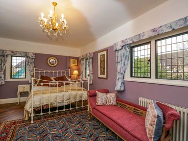 A bedroom with a bed and sofa at White House