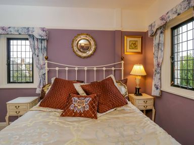 A bedroom with a bed and bedside table at White House 