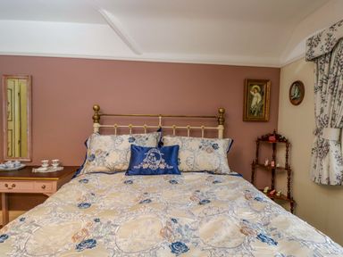A bedroom with bed and nightstand at White House