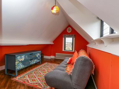 An attic with a sofa and a chest of drawers at White House