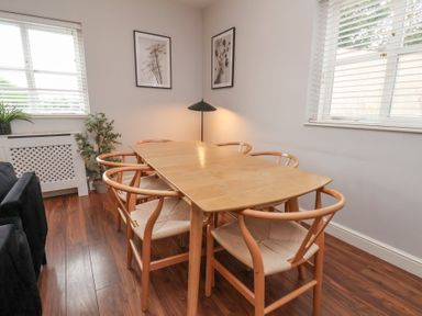 A dining room with a table and chairs at The Pheasantry in Flamborough