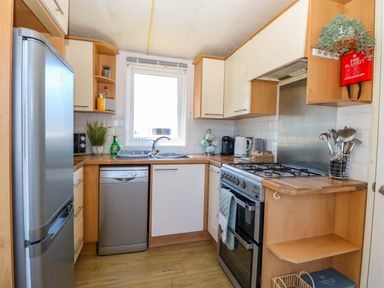 A kitchen with appliances and utensils at 25 Foxburrow Hang in Fritton near Belton