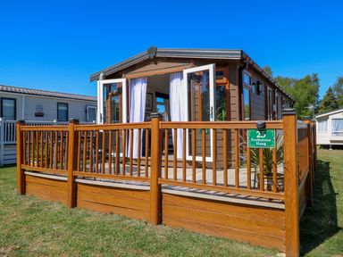 An outdoor view of a wooden deck at 25 Foxburrow Hang in Fritton near Belton