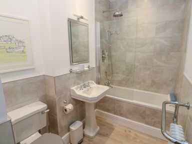 A bathroom with a toilet sink bathtub shower and mirror at Hindon Hall in Lelant near Carbis Bay