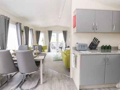 A dining area with table and chairs at The Haven