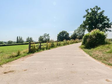 A pathway leading through fields at Piglet Corner in Culmstock