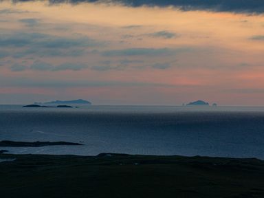 An ocean view with islands on the horizon during sunset at Heisgeir in Sollas Isle Of North Uist