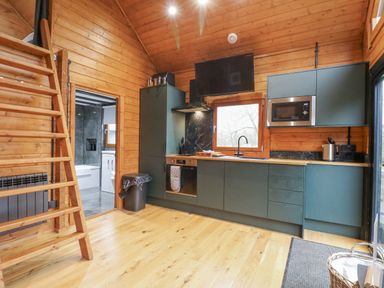 A kitchen with wooden features and appliances at Squirrel's Nest in South Luffenham near Edith Weston