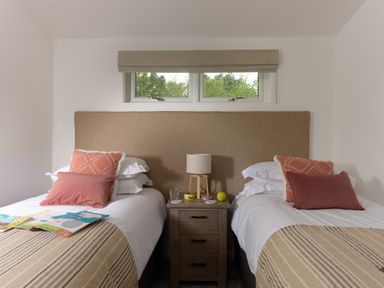 A bedroom with two single beds and a nightstand between them at 5 Southern Place in Dobwalls