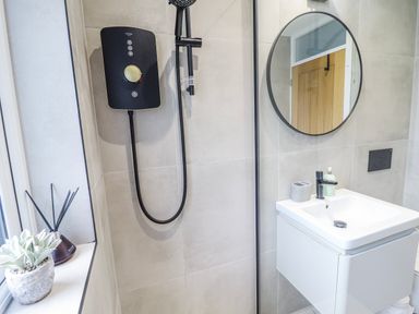A bathroom with a shower and sink at Hafod Y Bryn in Harlech