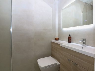 A bathroom with a toilet and sink at Beudy