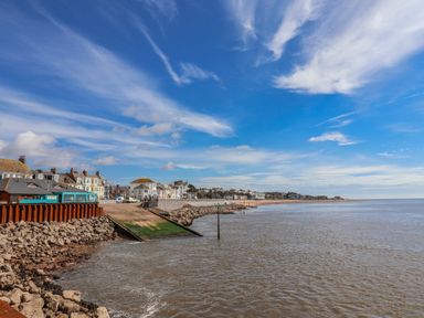 A view of the seafront with water and buildings at Sea Lovers in Exmouth