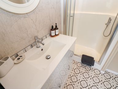 A bathroom with a sink and shower at A and C Lodge-Plot 21 Armathwaite