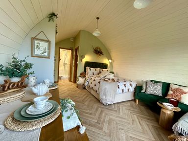 A bedroom with a bed and couch at Willow in Llangurig near Llanidloes