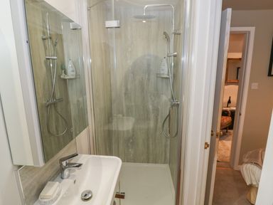 A bathroom with a sink and a shower at The Bindery in Broadway
