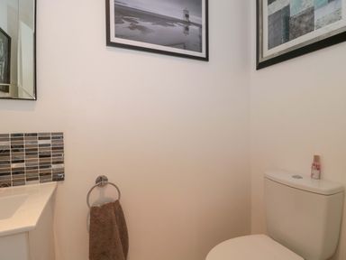 A bathroom with a sink and a toilet at No 8 Burnham-on-Sea